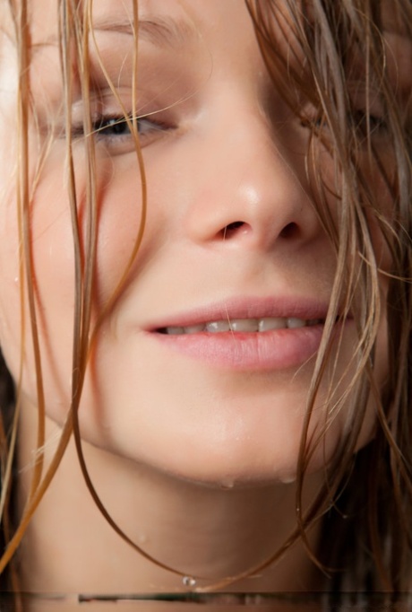 Teen solo girl Mia C uncovers her firm tits as she works free of her dress 70278922