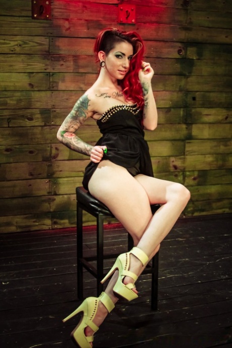 Tattooed redhead Mila Blaze is penetrated by lesbians while in bondage 90167133