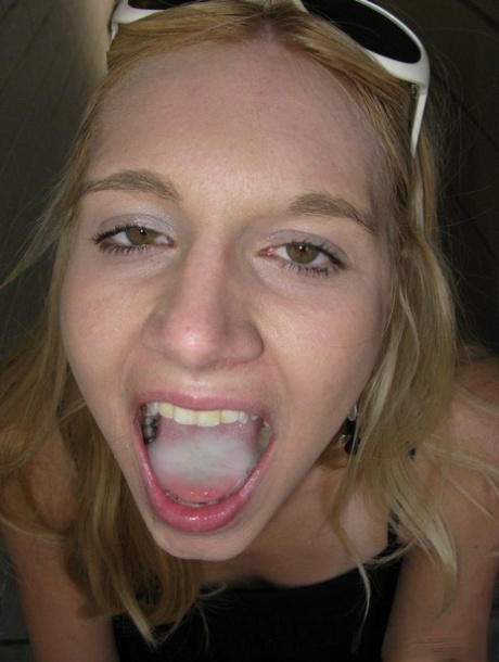 Blonde slut Becky Pureheart sports a mouthful of cum after a BJ inside a car 71528802