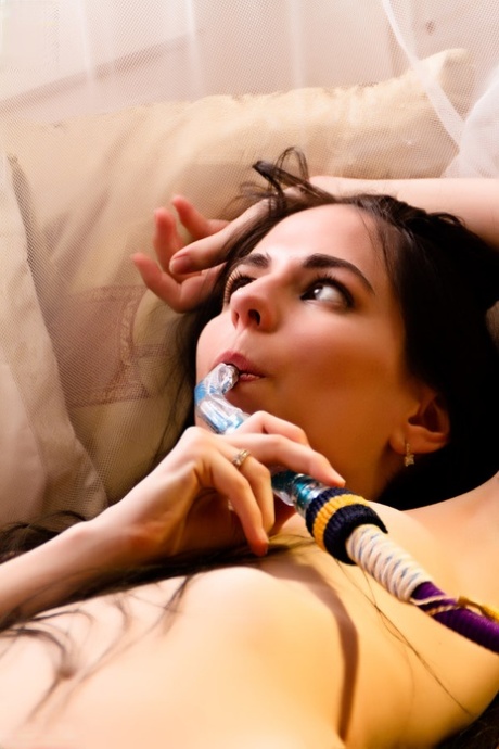 Naked girl Esmerelda draws on a hookah pipe during great solo poses 30321150