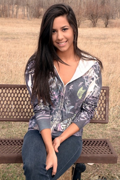 Amateur model Bella Quinn exposes black bra on an outdoor bench 68550300