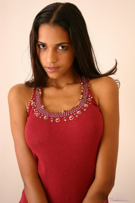 Alluring Latina girl Polliana cups her large tits in tight blue jeans 14613377