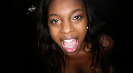 Naked ebony girl Armani gets a mouthful of cum via a gloryhole blowjob 58760655