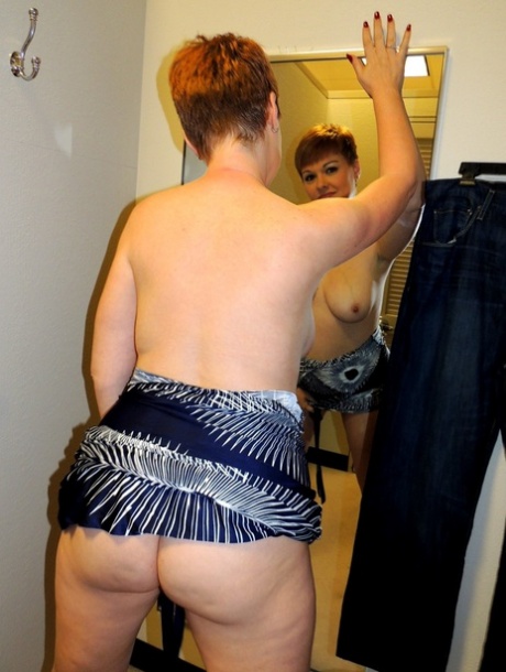 Middle-aged lady with short red hair Kali Devine licks a cock in a change room 74718297