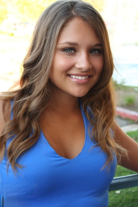 Cute teen Lili Jensen slides her skirt over her thong covered ass 42575428