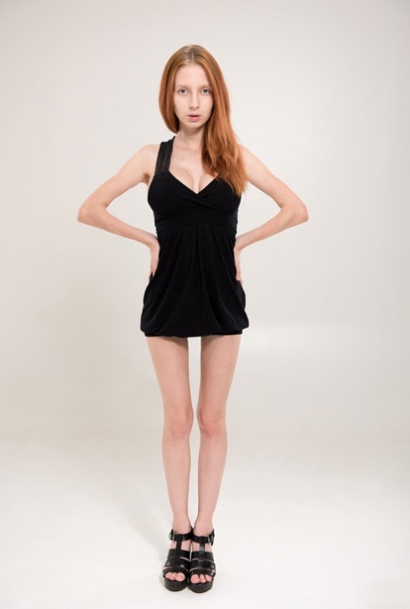 Skinny young redhead Helga reveals a huge set of knockers with hard nipples 82746448