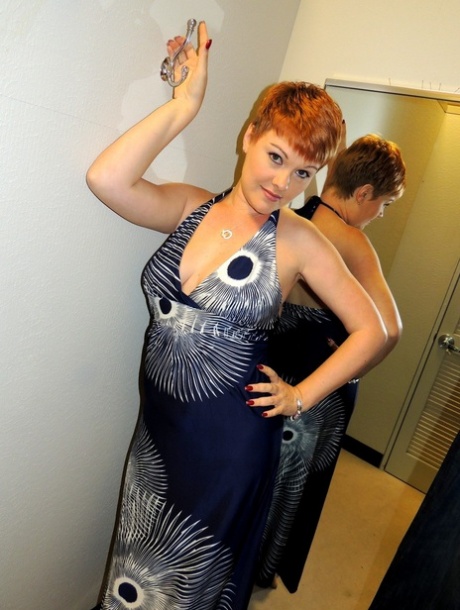 Amateur woman with short red hair Kali Devine gives a BJ in a dressing room 99391719