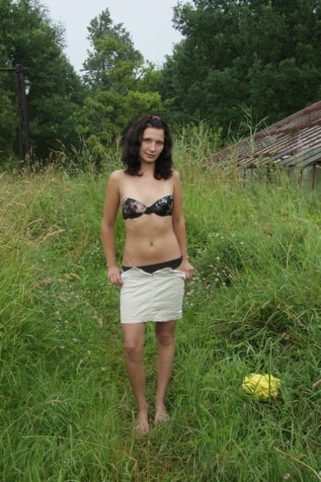 Young brunette Silvia gets completely naked on a blanket in the countryside 41857765
