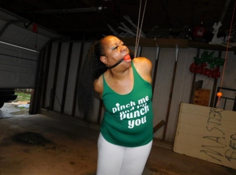 Ball gagged ebony girl struggles with her arms tied behind her back 51167941