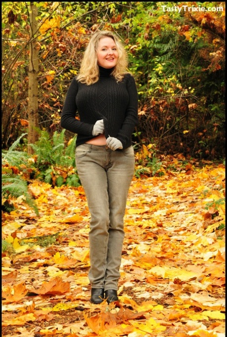 Mature woman Tasty Trixie exposes tits and panties amid fallen leaves 48044645