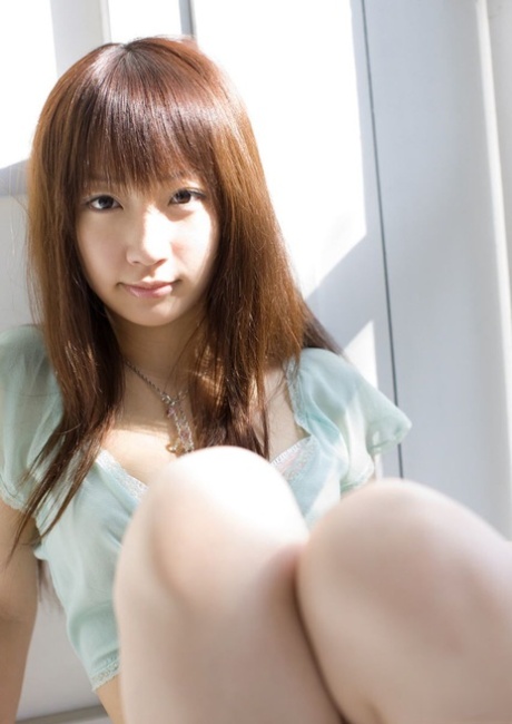 Adorable Japanese teen Hina Kurumi exposes her nice tits during solo action 95533972