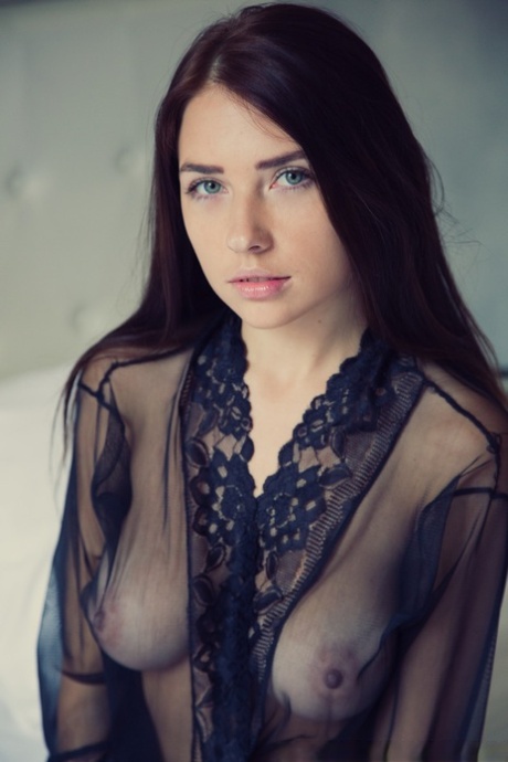 Gorgeous brunette Niemira removes sheer lingerie to stand naked on a bed 75677746
