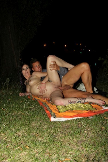 Mia De Berg and her man friend have sex on a towel upon the ground 98080264