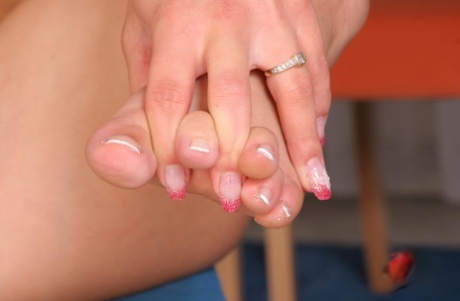 Naked redhead plays with her pretty toes during solo action 17484745