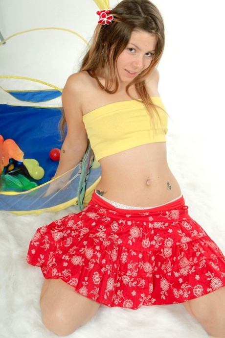 Charming young girl works her butt in a cute thong and socks 98358119