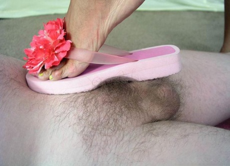 Blonde chick smacks her submissive lover's small cock with a flip-flop 41892892