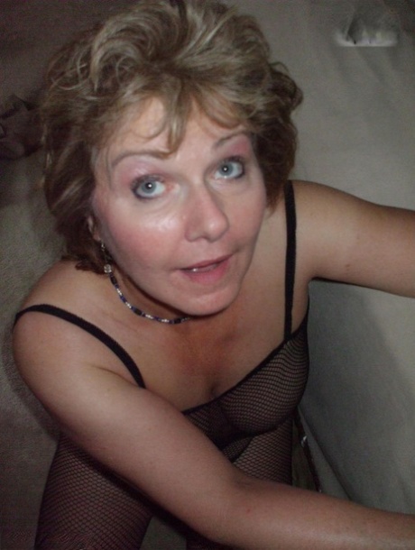 Older amateur Busty Bliss plays with a penis in a crotchless bodystocking 19908422