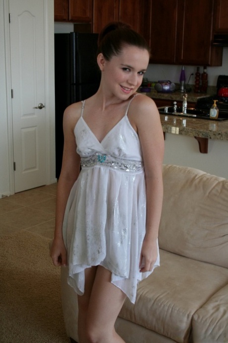 Young amateur slips out of her little dress to stand bare naked 52289499