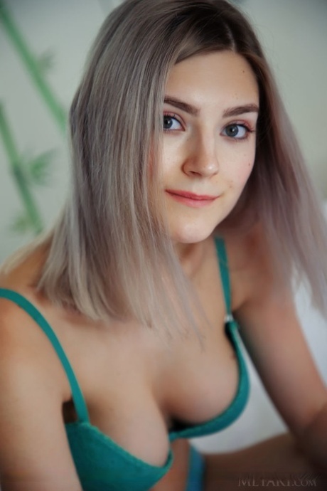 Sweet teen Eva Elfie doffs a bra and panty set to model naked on her bed 13173942