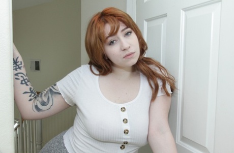 Curvy redhead with tattoos Amilia Onyx gives her stepbrother a blowjob 56986674