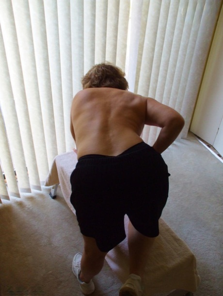 Middle-aged amateur Busty Bliss displays her big tits during a home workout 55586554