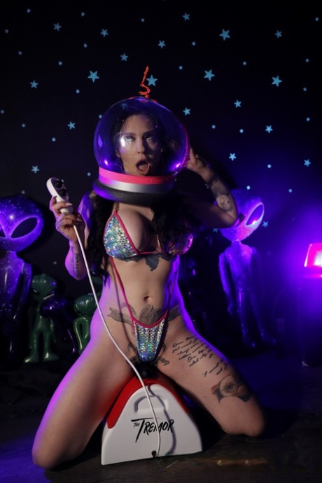 Tattooed brunette Misha Montana models a bikini for a couple of aliens 22835781