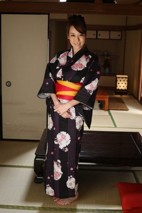 Japanese beauty Akari Asayiri works her tits and pussy free of a robe 50557210