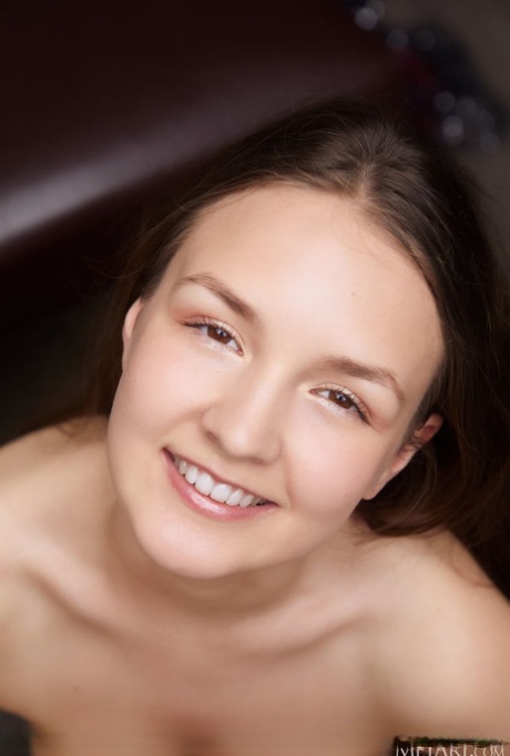 Pretty brunette teen Bellaria takes off her dress for confident nude poses 69850283