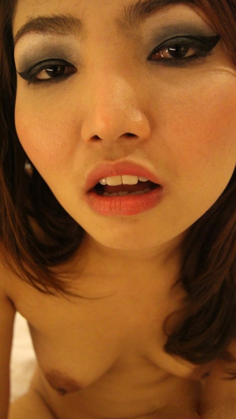 Cute Thai girl Jar plays with her pussy after getting totally naked on a bed 43050048