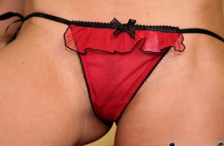 Alluring brunette strips nude and puts on sexy red&black lingerie 27526461