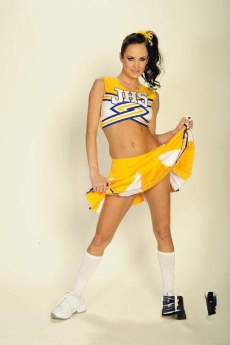 Busty babe Alektra Blue takes off cheerleader uniform to show pussy 14336787