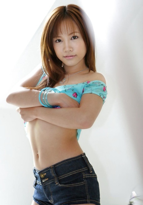Lovely asian babe with sexy legs Reika Shina slipping off her clothes 94728145